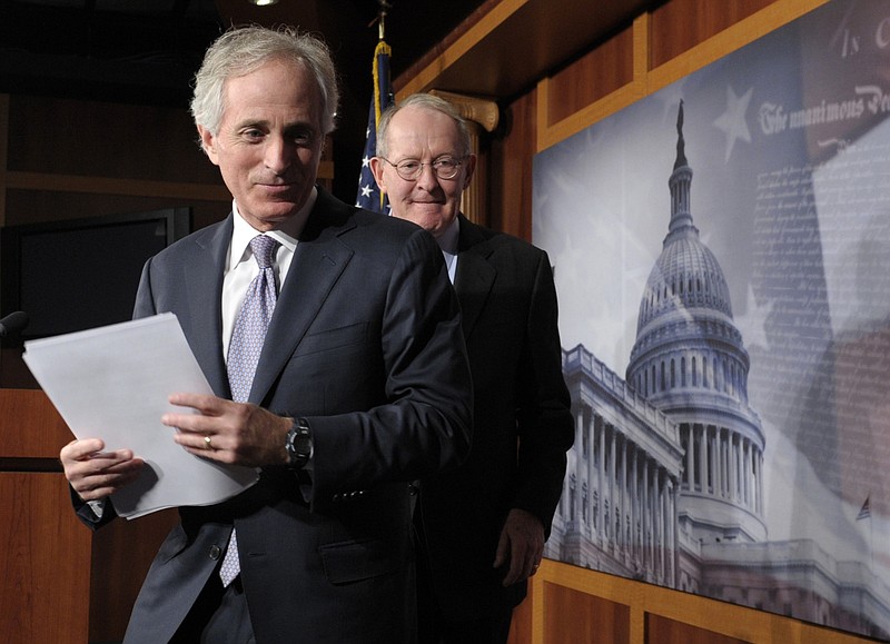 Sen. Bob Corker, R-Tenn., left, and Sen. Lamar Alexander, R-Tenn., leave a 2012 news conference on Capitol Hill. (AP Photo/Susan Walsh)