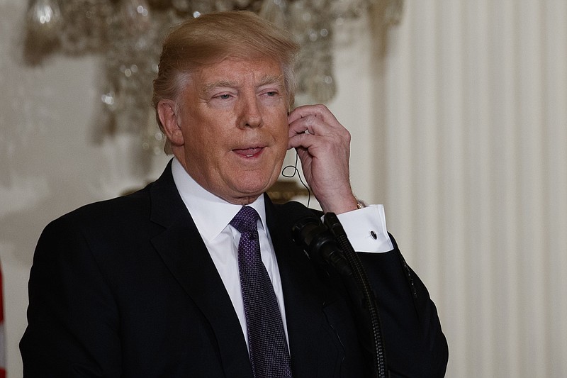 
              President Donald Trump listens as Canadian Prime Minister Justin Trudeau speaks during a joint news conference in the East Room of the White House, Monday, Feb. 13, 2017, in Washington. (AP Photo/Evan Vucci)
            