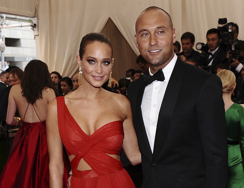 
              FILE - In this May 4, 2015, file photo, Derek Jeter, right, and Hannah Davis arrive at The Metropolitan Museum of Art's Costume Institute benefit gala celebrating "China: Through the Looking Glass" in New York. Hannah Jeter announced on Monday, Feb. 13, 2017, that the couple is expecting their first child together. (Photo by Charles Sykes/Invision/AP, File)
            