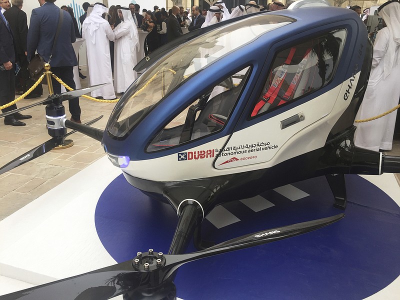 
              A model of EHang 184 and the next generation of Dubai Drone Taxi is seen during the seconde day of the World Government Summit in Dubai, United Arab Emirates, Monday, Feb. 13, 2017. Dubai hopes to have a passenger-carrying drone buzzing through the skyline of this futuristic city-state in July. Mattar al-Tayer, the head of Dubai's Roads & Transportation Agency, made the surprise announcement Monday at the World Government Summit. (AP Photo/Jon Gambrell)
            