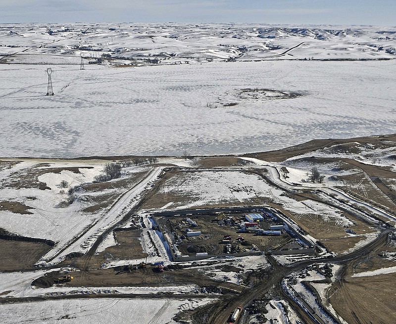 This aerial photo shows a site where the final phase of the Dakota Access Pipeline will take place with boring equipment routing the pipeline underground and across Lake Oahe to connect with the existing pipeline in Emmons County, Monday, Feb. 13, 2017, in Cannon Ball, N.D. It is the last big section of the $3.8 billion pipeline, which would carry oil from North Dakota to Illinois. A federal judge on Monday refused to stop construction on the last stretch of the pipeline, which is progressing much faster than expected. (Tom Stromme/The Bismarck Tribune via AP)