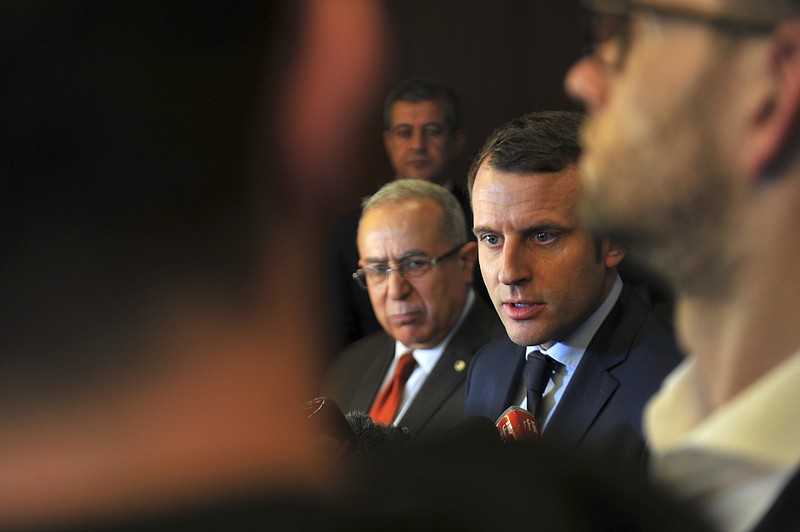 
              French Presidential candidate Emmanuel Macron, center right, answers reporters with Algerian Foreign Minister Ramtane Lamamra, left, in Algiers, Monday Feb. 13, 2017. Claims made by Macron's campaign chairman Richard Ferrand Monday, assert that Russian groups are interfering with his presidential campaign but have offered little evidence to back up the claim. (AP Photo/Anis Belghoul)
            