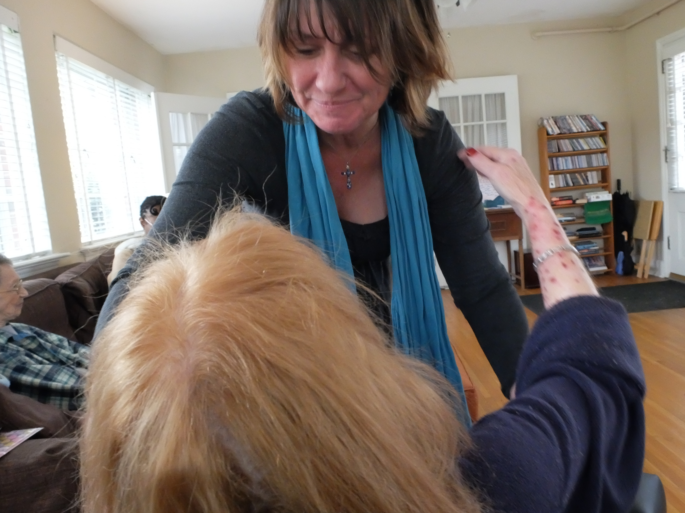 Welcome Home of Chattanooga executive director Sherry Campbell reassures a resident of care Tuesday at the Germantown Road facility.