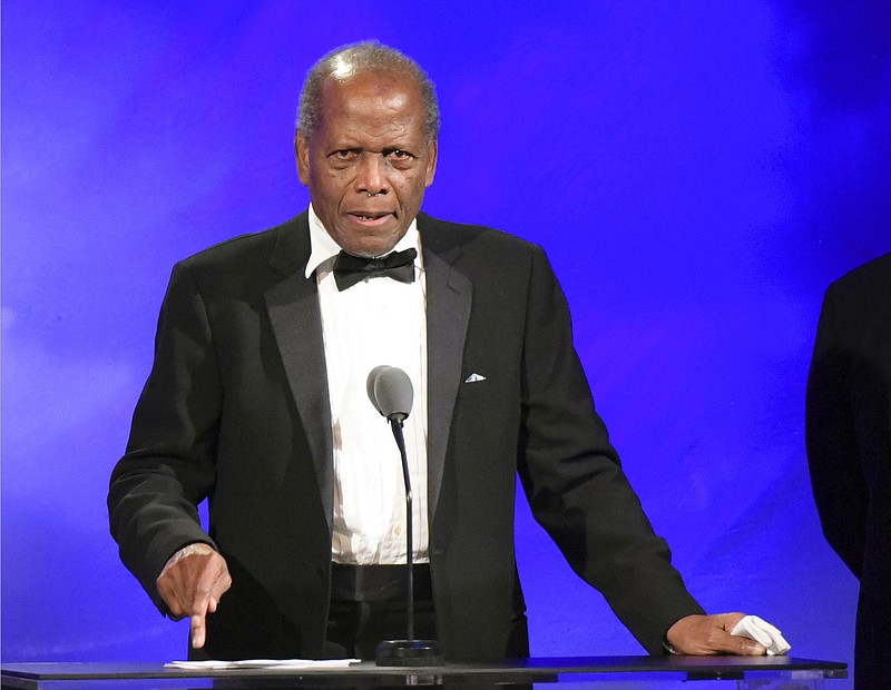 
              FILE - This Oct. 8, 2016 file photo shows Sidney Poitier speaking at the 2016 Carousel Of Hope Ball in Beverly Hills, Calif.  Turner Classic Movies is recognizing Poitier, Debbie Reynolds and Carrie Fisher at its eighth annual TCM Classic Film Festival in April. The Los Angeles event opens April 6 with a 50th anniversary screening of “In the Heat of the Night.” Festival organizers say Poitier will appear at the screening, along with producer Walter Mirisch, director Norman Jewison, actress Lee Grant and composer Quincy Jones. (Photo by Richard Shotwell/Invision/AP, File)
            