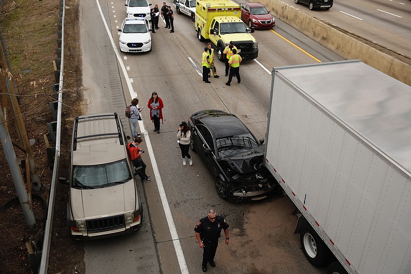 Crews work the scene of a multi vehicle collision on Interstate 24 eastbound on Tuesday afternoon. At least 8 vehicles were involved in the collision with a semi-trailer, and one lane of traffic is open.

