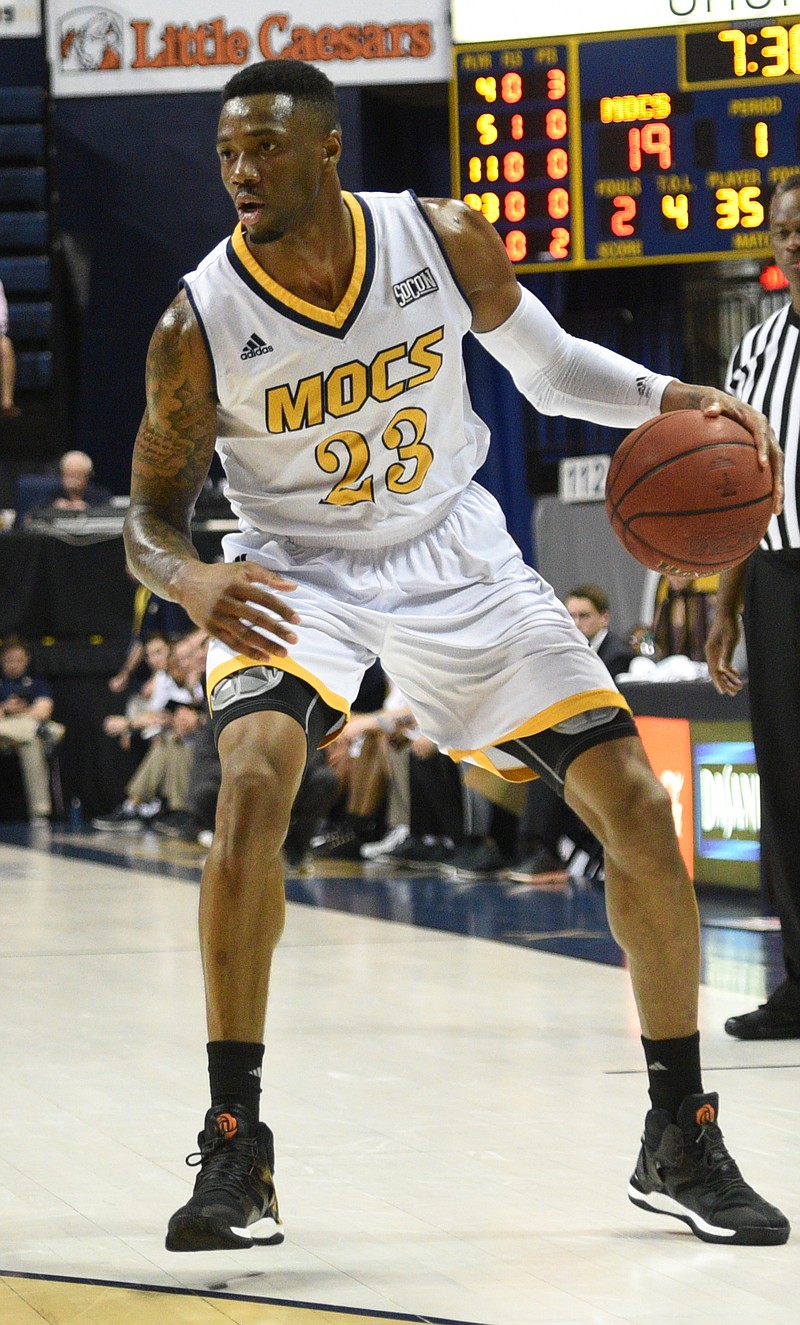 UTC's Tre' McLean dribbles during the Mocs' 80-64 loss to VMI last month at McKenzie Arena. UTC won at VMI on Wednesday night.