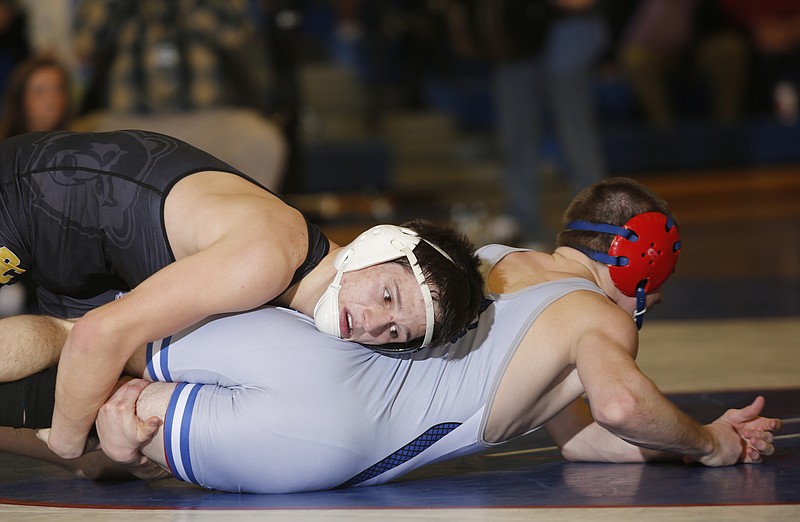 Bradley Central senior wrestler Ryan McElhaney, top, controls Cleveland's Colton Landers in their 132-pound match during a dual last month at Cleveland. McElhaney is 38-2 entering the AAA state traditional tournament, which starts today in Franklin.