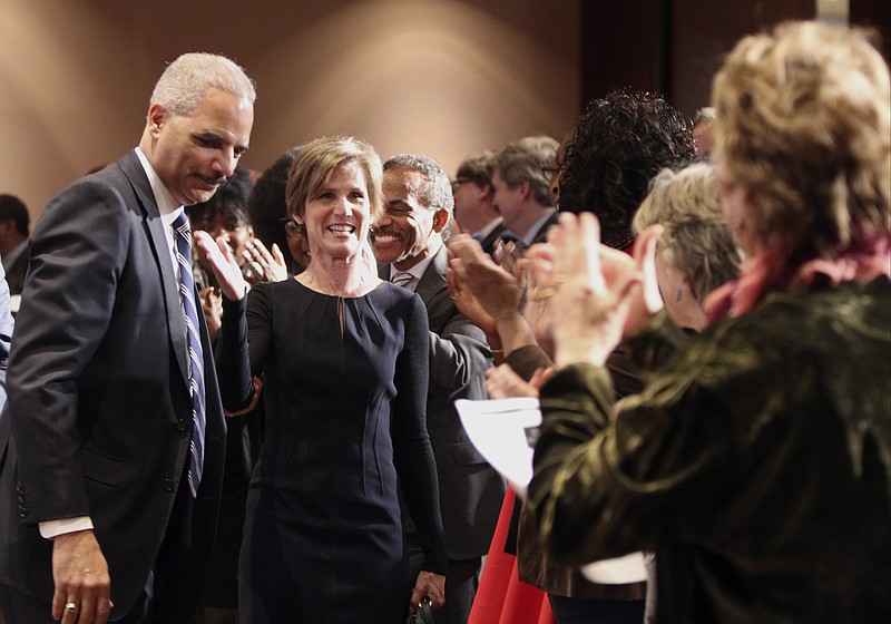 
              Before taking her seat in the audience, former Attorney General Sally Yates points back at former Attorney General Eric Holder after he did the same to her moments before at the Jimmy Carter Presidential Library in Atlanta, Wednesday, Feb. 15, 2017. Holder said during a panel discussion on race on Wednesday that he worries some Obama administration reforms to the criminal justice system could be in jeopardy under President Donald Trump. (Henry P. Taylor/Atlanta Journal-Constitution via AP)
            