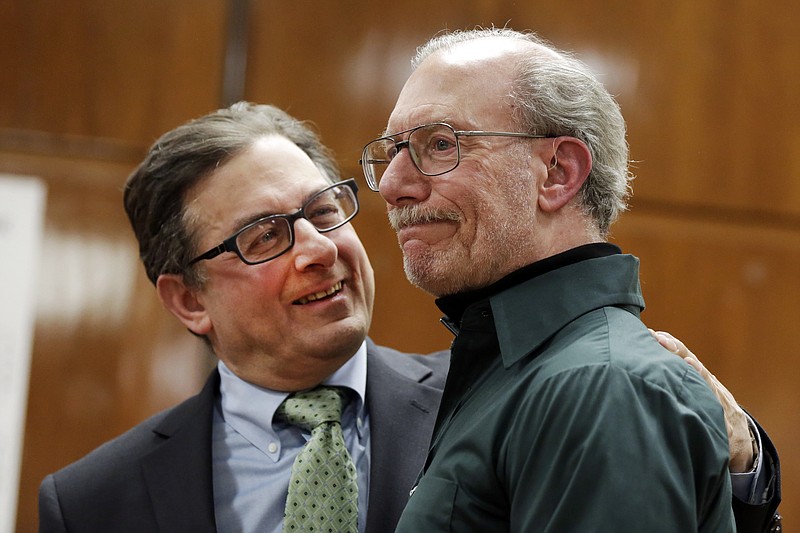Stan Patz, right, father of 6-year-old Etan Patz who disappeared on the way to the school bus stop 38 years ago, reacts after a news conference with Assistant District Attorney Joel Seidemann, following the second trial of Pedro Hernandez, whos convicted of killing the boy, Tuesday, Feb. 14, 2017, in New York's Manhattan Supreme Court. (AP Photo/Richard Drew)