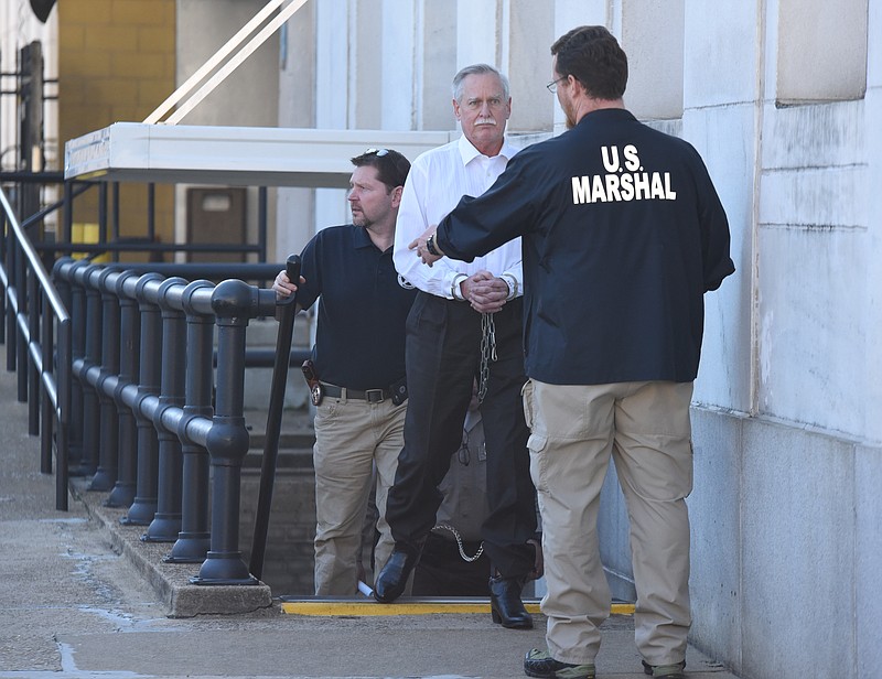 Former Tennessee Valley Authority engineer Robert Doggart is escorted from the Joel W. Solomon Federal Building in Chattanooga after his four count conviction of planning an attack on a Muslim community.