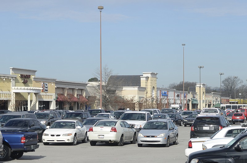 Cars are seen in the parking lot Wednesday at the Eastgate Town Center.