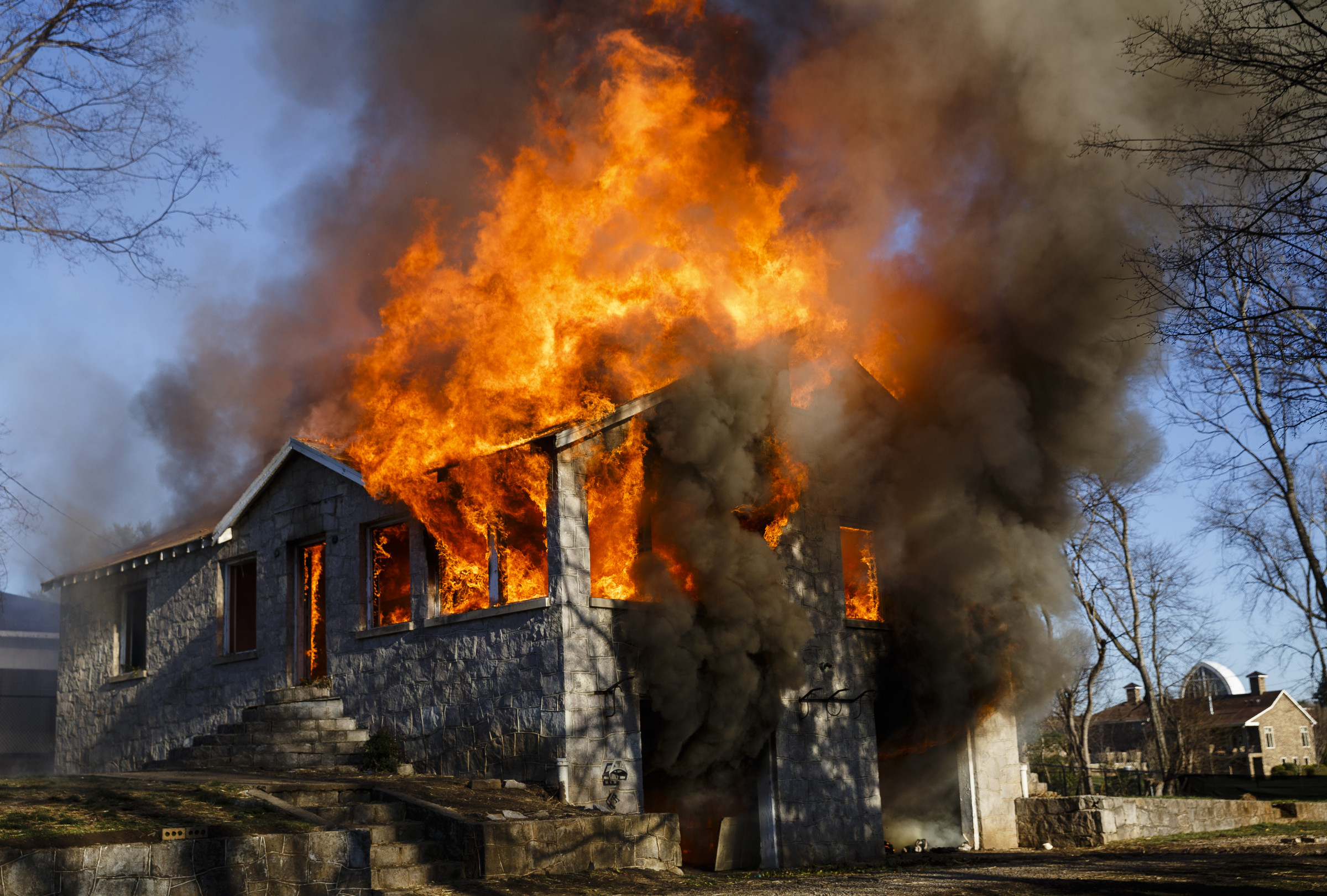 The vacant structure becomes fully engulfed at a live burn training event by the Chattanooga Fire Department on Robin Drive on Thursday, Feb. 16, 2017, in Chattanooga, Tenn. The fire department uses live burns as part of their fire academy training, culminating in the complete immolation of a structure.