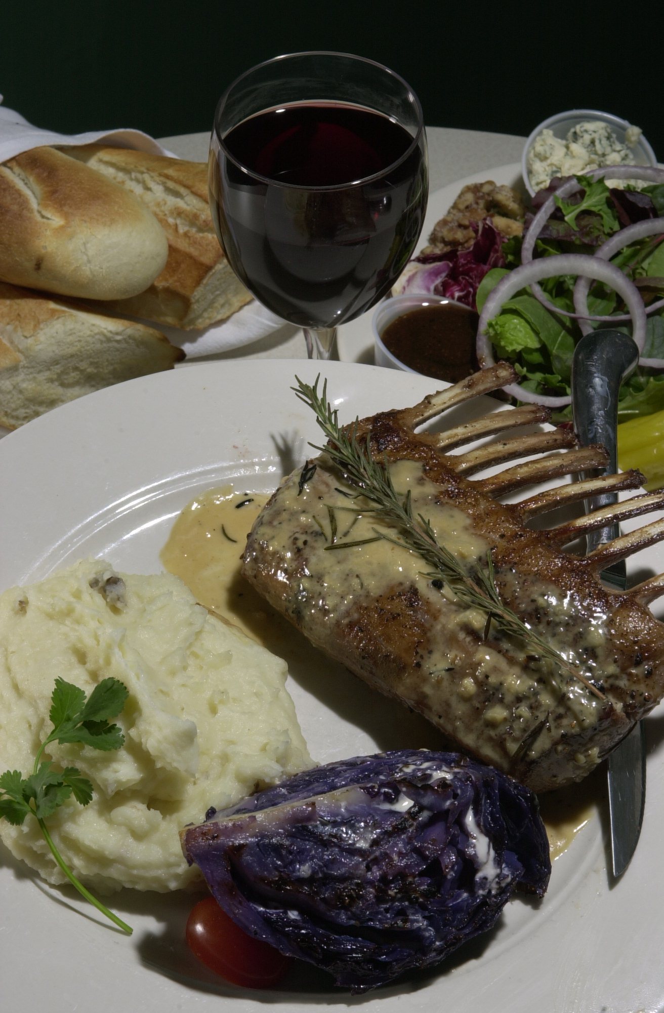 Staff Photo by Alex McMahan Rack of lamb, garlic mashed potatoes and grilled red gabbage are one of many elegant dinners served at the Canyon Grill.