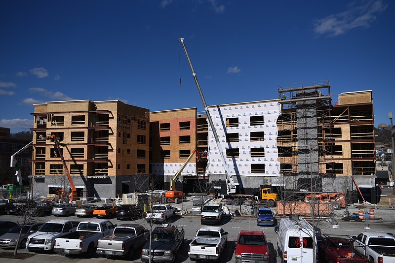 Staff Photo by Angela Lewis Foster Work continues on an apartment building at Cherokee Boulevard and Manufacturers Road by Vision Hospitality Group.