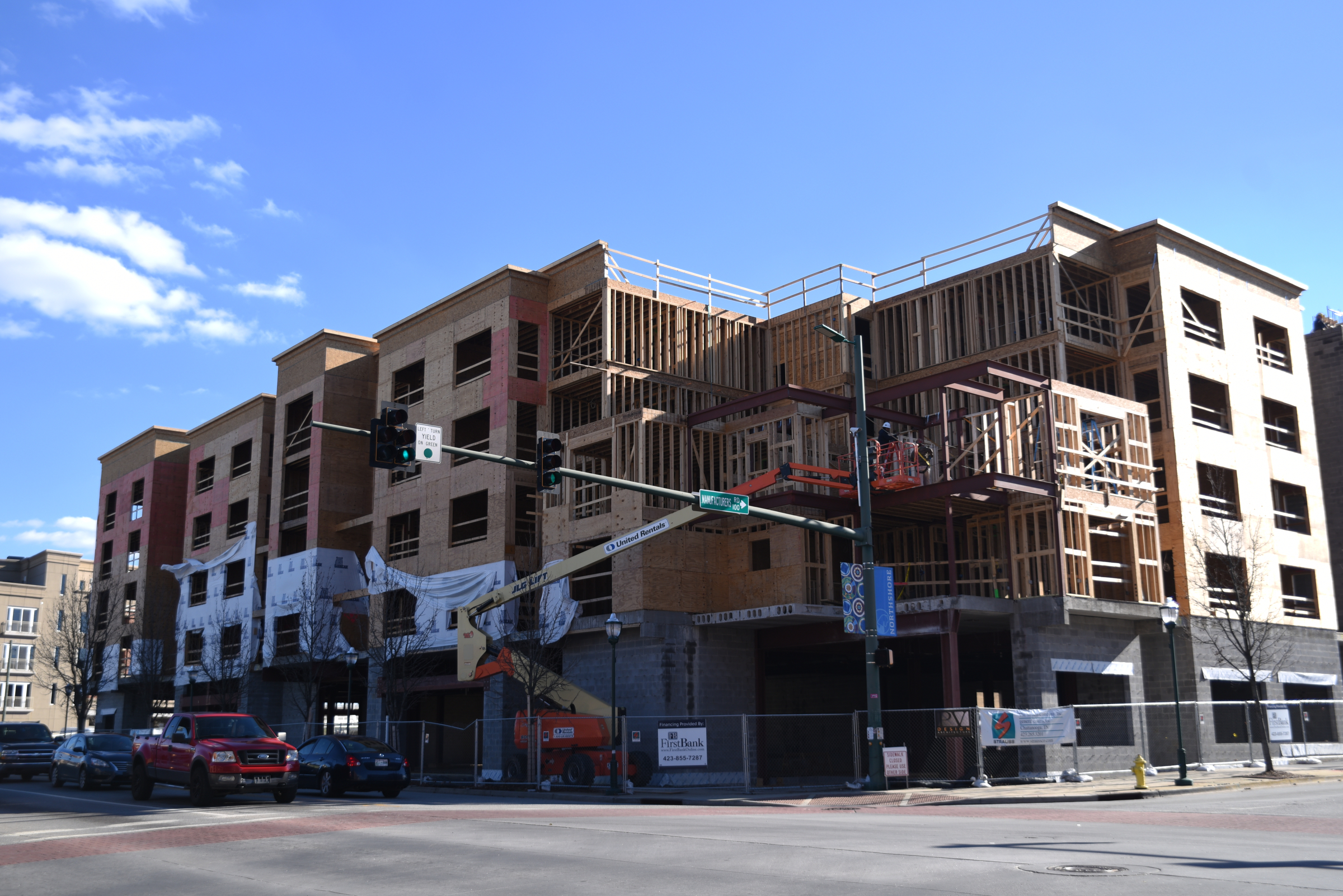 Staff Photo by Angela Lewis Foster Work continues on an apartment building at Cherokee Boulevard and Manufacturers Road by Vision Hospitality Group.