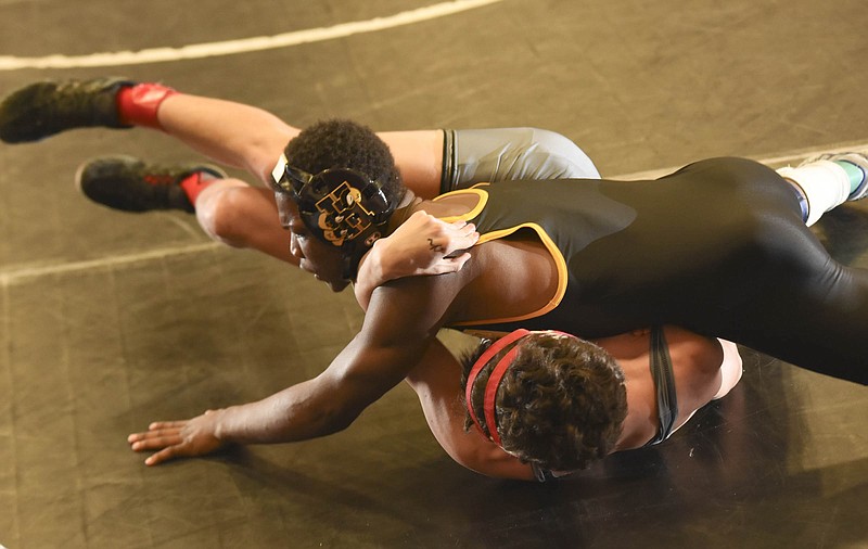 Hixson's Cederick Harris earns near-fall points on his way to an 8-0 win against Whitwell's Addison Cordell during a 138-pound match last week at the Region 2-A/AA tournament at Signal Mountain.
