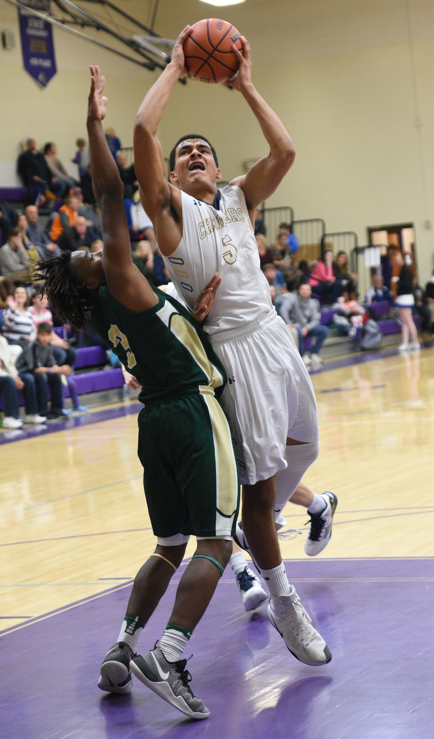 Chattanooga Christian's Ben Moore is guarded by Notre Dame's Akil Sledge Thursday, Feb. 16, 2017 at Sequatchie County High School.