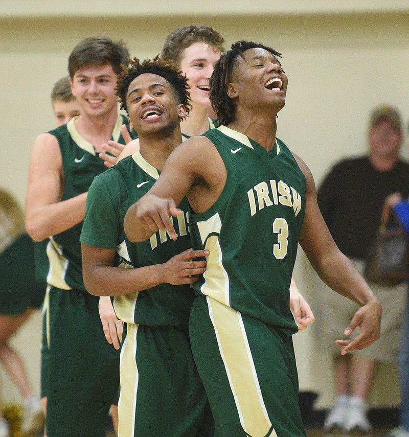 Notre Dame's Akil Sledge, right, and others celebrate a win over Chattanooga Christian Thursday, Feb. 16, 2017 at Sequatchie County High School.