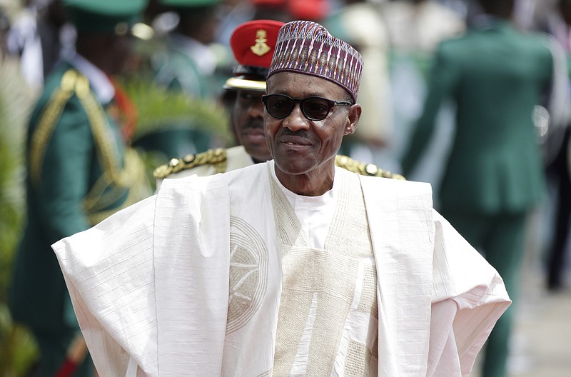 
              FILE- In this file photo taken Friday, May 29, 2015, Nigerian President elect, Muhammadu Buhari, arrives for his Inauguration at the eagle square in Abuja, Nigeria. Nigerian President Muhammadu Buhari's nearly month-long medical leave in London is reminding his country's taxpayers that while they finance their leaders' health care abroad, they often are stuck with decrepit, ill-staffed government health facilities at home. (AP Photo/Sunday Alamba, File)
            