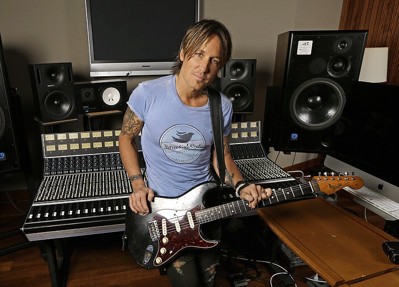 
              FILE - In this April 14, 2016, file photo, Keith Urban poses in Nashville, Tenn., to promote his latest album, "Ripcord." Urban leads nominations for the Academy of Country Music Awards with seven nominations as both artist and producer for his record “Ripcord.” The nominations were announced Thursday, Feb. 16, 2017, on “CBS This Morning.” (AP Photo/Mark Humphrey, File)
            