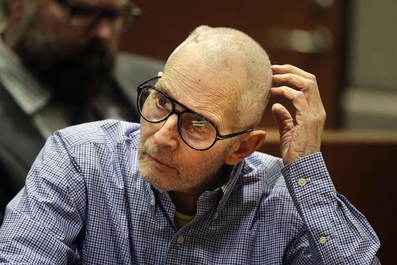 In this Dec. 21, 2016 file photo, real estate heir Robert Durst sits in a courtroom during a hearing in Los Angeles. Before a judge even decides if there's enough evidence to try Durst on an old murder charge, prosecutors plan to start taking testimony. In a rare hearing Tuesday, Feb. 13, two witnesses will be called to the witness stand against Durst in Los Angeles Superior Court to preserve their testimony in case it is needed later.(AP Photo/Jae C. Hong, Pool, File)