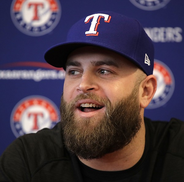 Mike Napoli talks to the media during a news conference at spring training  baseball practice Thursday, Feb. 16, 2017, in Surprise, Ariz. The Rangers  announced that the club has signed free agent