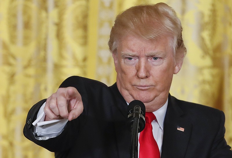 
              President Donald Trump points to a member of the media as he takes questions during a news conference in the East Room of the White House in Washington, Thursday, Feb. 16, 2017. (AP Photo/Pablo Martinez Monsivais)
            