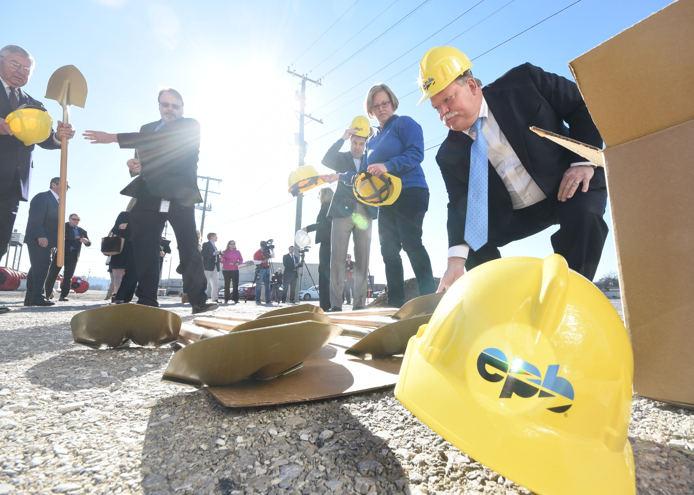 Hamilton County Mayor Jim Coppinger reaches for a shovel Friday morning as the Electric Power Board prepares to break ground for a 4.5-acre solar garden facing Holtzclaw Avenue, across from the Chattanooga Zoo.