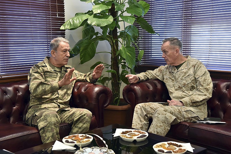 
              The U.S. chairman of the Joint Chiefs of Staff, Gen. Joseph Dunford, right, and Turkey's Chief of Staff Gen. Hulusi Akar talk during a meeting in Incirlik Airbase in Adana, Turkey, Friday, Feb. 17, 2017.  Turkey's military says the Turkish and U.S. chiefs of staff have "confirmed" the need to fight terror groups in Syria and Iraq, including the Islamic State group and Kurdish militants.(Turkish Military, Pool Photo via AP)
            