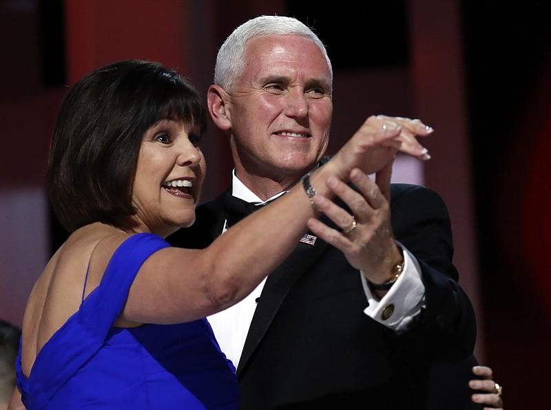 
              FILE - In this Jan. 20, 2017, file photo, Vice President Mike Pence dances with his wife Karen at the Liberty Ball in Washington. Karen Pence wants people to know that art therapy isn’t exactly arts and crafts. The wife of Vice President Mike Pence has been a passionate advocate of art therapy for many years, including during her recent stint as first lady of Indiana. Now, she hopes to use her new and loftier public profile to raise awareness of the mental health profession and help change the public’s perceptions about what art therapists actually do. (AP Photo/Alex Brandon, File)
            