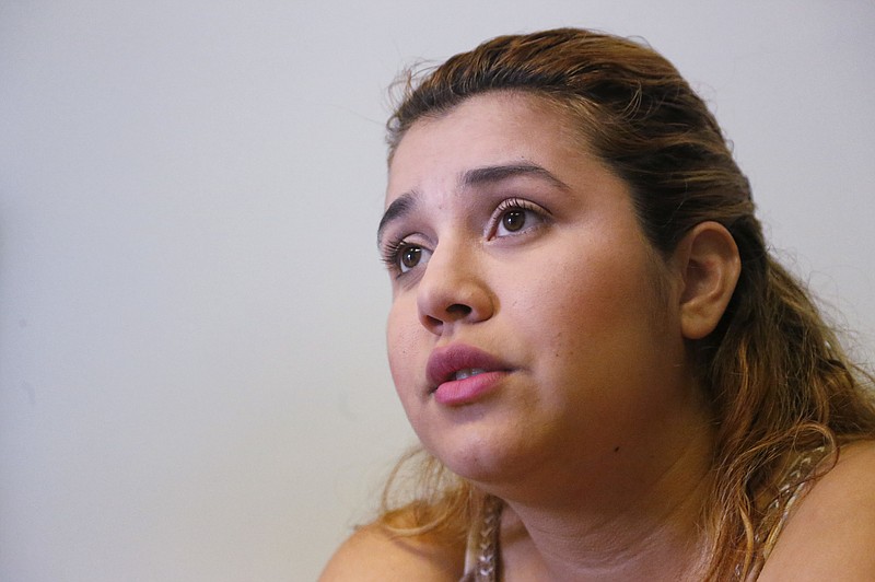 
              In this, Monday, Feb. 13, 2017, photo, Itzel Munoz, 23, who was brought to the U.S. as a child from Mexico, speaks during an interview with The Associated Press in Homestead, Fla. A county with an immigrant leader where most people were born abroad has bucked the trend of the sanctuary city movement, creating fear among the undocumented and exposing a long-standing disconnect between Cuban-Americans and the rest of the Latinos. Miami-Dade's Cuban-born Mayor Carlos Gimenez went against other immigrant-rich cities in ordering its officials to abide by President Donald Trump's immigration orders. (AP Photo/Wilfredo Lee)
            