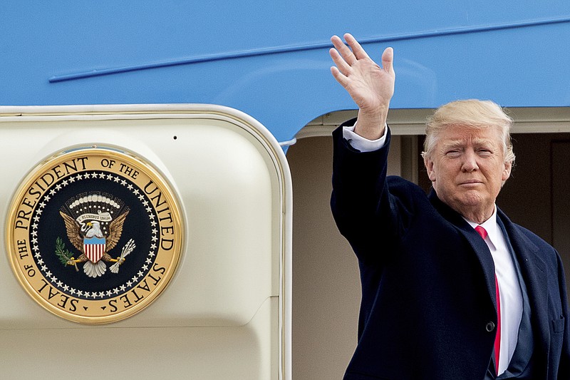 President Donald Trump waves before boarding Air Force One at Andrews Air Force Base in Md., Friday, Feb. 17, 2017. Trump is visiting Boeing South Carolina to see the Boeing 787 Dreamliner before heading to his estate Mar-a-Lago in Palm Beach, Fla., for the weekend. (AP Photo/Andrew Harnik)