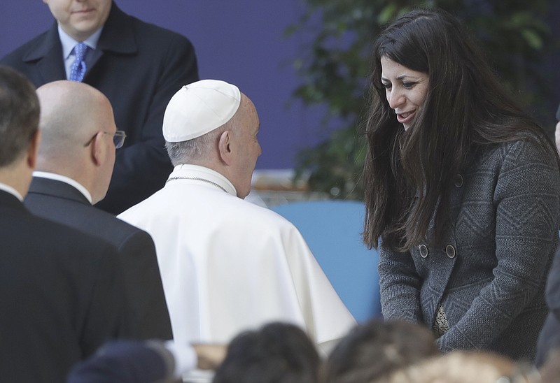 
              Pope Francis meets Nour Essa, part of a group of Syrian refugees arrived in Rome with Pope Francis from the Greek island of Lesbos, at the Roma Tre University in Rome, Friday, Feb. 17, 2017. (AP Photo/Alessandra Tarantino)
            
