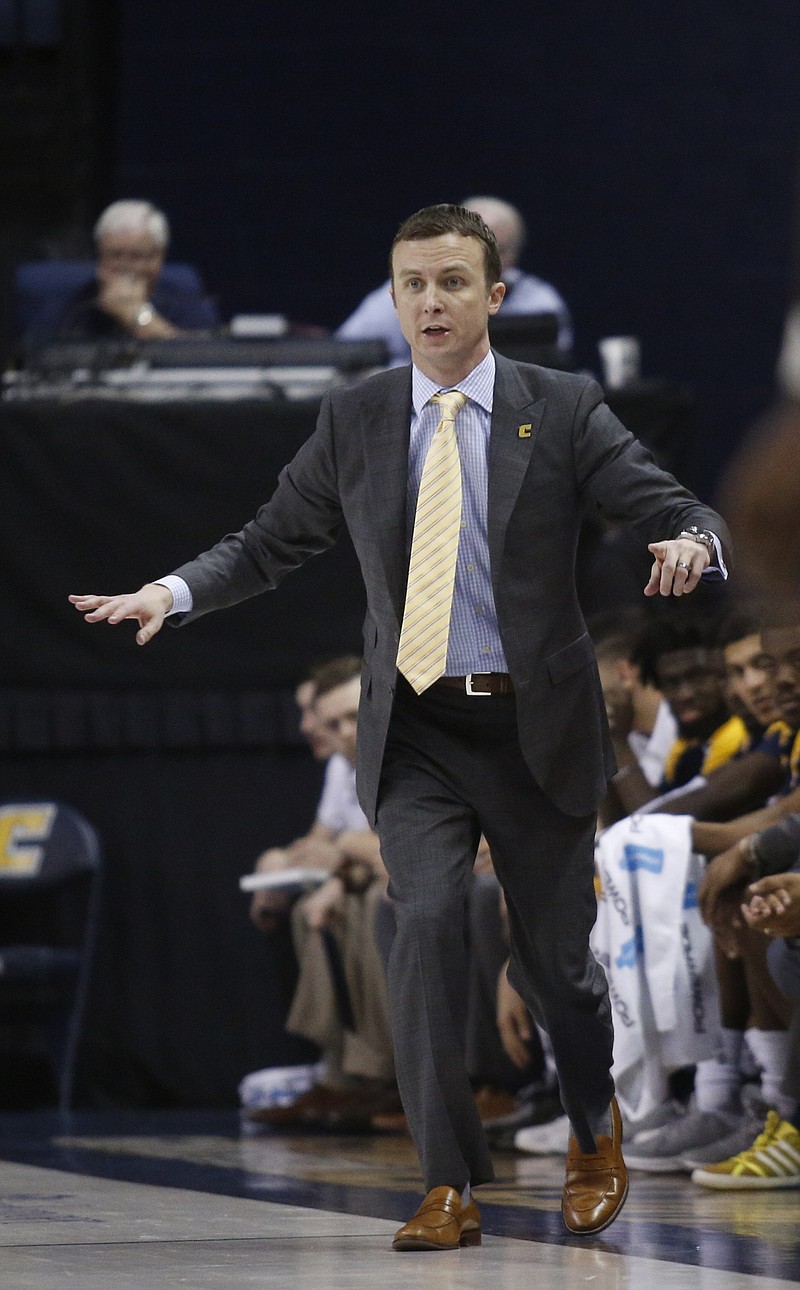 UTC basketball coach Matt McCall directs players during the Mocs' basketball game against the ETSU Buccaneers at McKenzie Arena on Saturday, Feb. 18, 2017, in Chattanooga, Tenn. UTC fell to 10-5 in the SoCon following their 65-51 loss to ETSU.