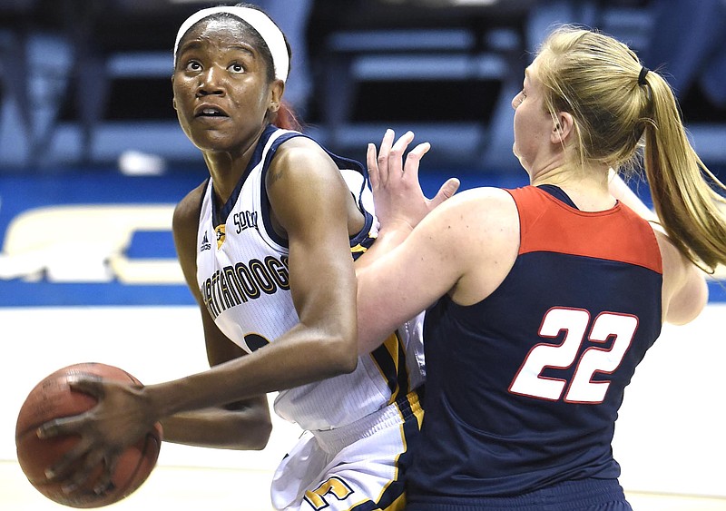 UTC's Jasmine Joyner (3) looks to the basket while Samford's Ellen Riggins (22) defends.  The Samford Bulldogs visited the UTC Mocs in Southern Conference women's basketball action at McKenzie Arena on February 4, 2017.  