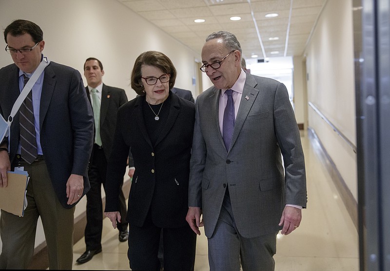 
              Senate Minority Leader Chuck Schumer of N.Y., right, walks with Sen. Dianne Feinstein, D-Calif., vice chair of the Senate Intelligence Committee, on Capitol Hill in Washington, Friday, Feb. 17, 2017, following a closed-door intelligence briefing by FBI Director James Comey. (AP Photo/J. Scott Applewhite)
            