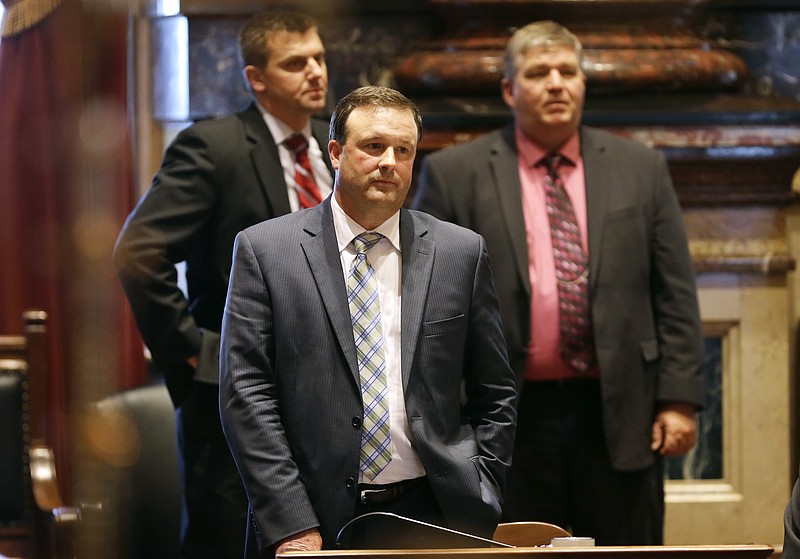 
              FILE - In this Thursday, May 1, 2014, file photo, Iowa Senate Minority Leader Bill Dix, R-Shell Rock, center, looks on as Iowa Senate Majority Leader Michael Gronstal speaks on the floor of the Senate at the Statehouse in Des Moines, Iowa. After decades as the crossroads of prairie populists and checkbook conservatives, Iowa has suddenly become solidly Republican like many of its Midwestern neighbors. To act cautiously in light of November’s heavy Republican legislative victories could hurt the GOP’s chances of holding its majority, so it’s all or nothing, Dix said. “That’s what our mandate is, and to me it’s not one that’s very patient.” (AP Photo/Charlie Neibergall, File)
            