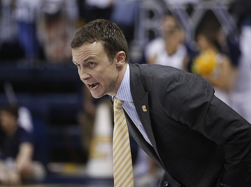 UTC men's basketball coach Matt McCall instructs his players during the Mocs' 65-51 home loss to ETSU on Saturday. The Mocs have three games remaining in the regular season before the SoCon tournament.