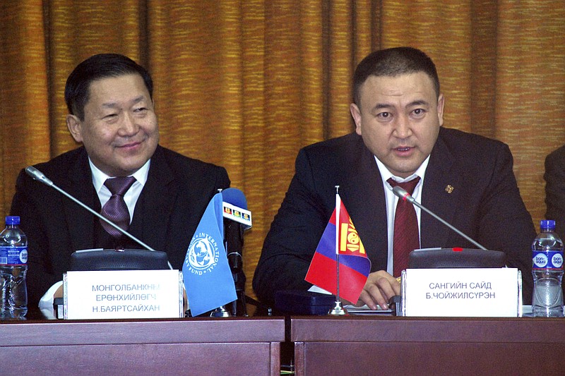 
              Bayartsaikhan Nadmid, Governor of the Bank of Mongolia, left, listens as Choijilsuren Battogtokh, Mongolia's Minister of Finance, right, speaks at a press conference in Ulaanbaatar, Mongolia, Sunday, Feb. 19, 2017. The Mongolian government and envoys from the International Monetary Fund said Sunday that they and other partners have agreed on terms for a more than $5 billion loan package to the north Asian country to help get its economy back on track. (AP Photo/Ganbat Namjilsangarav)
            