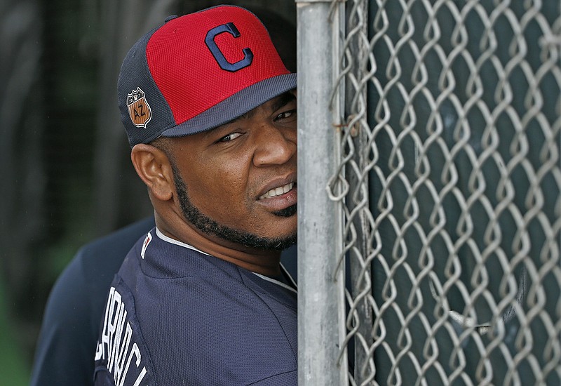 
              Cleveland Indians first baseman and designated hitter Edwin Encarnacion watches the rain fall from the batting cages at the Indians baseball spring training facility, Sunday, Feb. 19, 2017, in Goodyear, Ariz. (AP Photo/Ross D. Franklin)
            