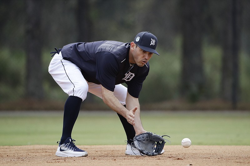 
              Detroit Tigers' Ian Kinsler fields a ball during a spring training baseball workout Saturday, Feb. 18, 2017, in Lakeland, Fla. (AP Photo/Matt Rourke)
            