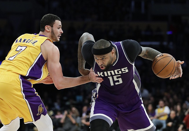 
              FILE - In this Tuesday, Feb. 14, 2017, file photo, Sacramento Kings' DeMarcus Cousins, right, drives past Los Angeles Lakers' Larry Nance Jr. during the second half of an NBA basketball game in Los Angeles. A person familiar with the situation said Sunday that the Sacramento Kings have agreed to trade Cousins and Omri Casspi to the New Orleans Pelicans in exchange for Tyreke Evans, 2016 first-round draft pick Buddy Hield, Langston Galloway and first- and second-round draft picks this summer. (AP Photo/Jae C. Hong, File)
            