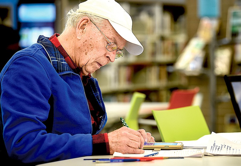 Hernando Chovil, 75, studies at the Southeast Branch Library in Antioch, Tenn. Chovil is an immigrant from Columbia and is taking classes for his GED so he can carry on his profession as a CPA here in the U.S. (Lacy Atkins/The Tennessean via AP)