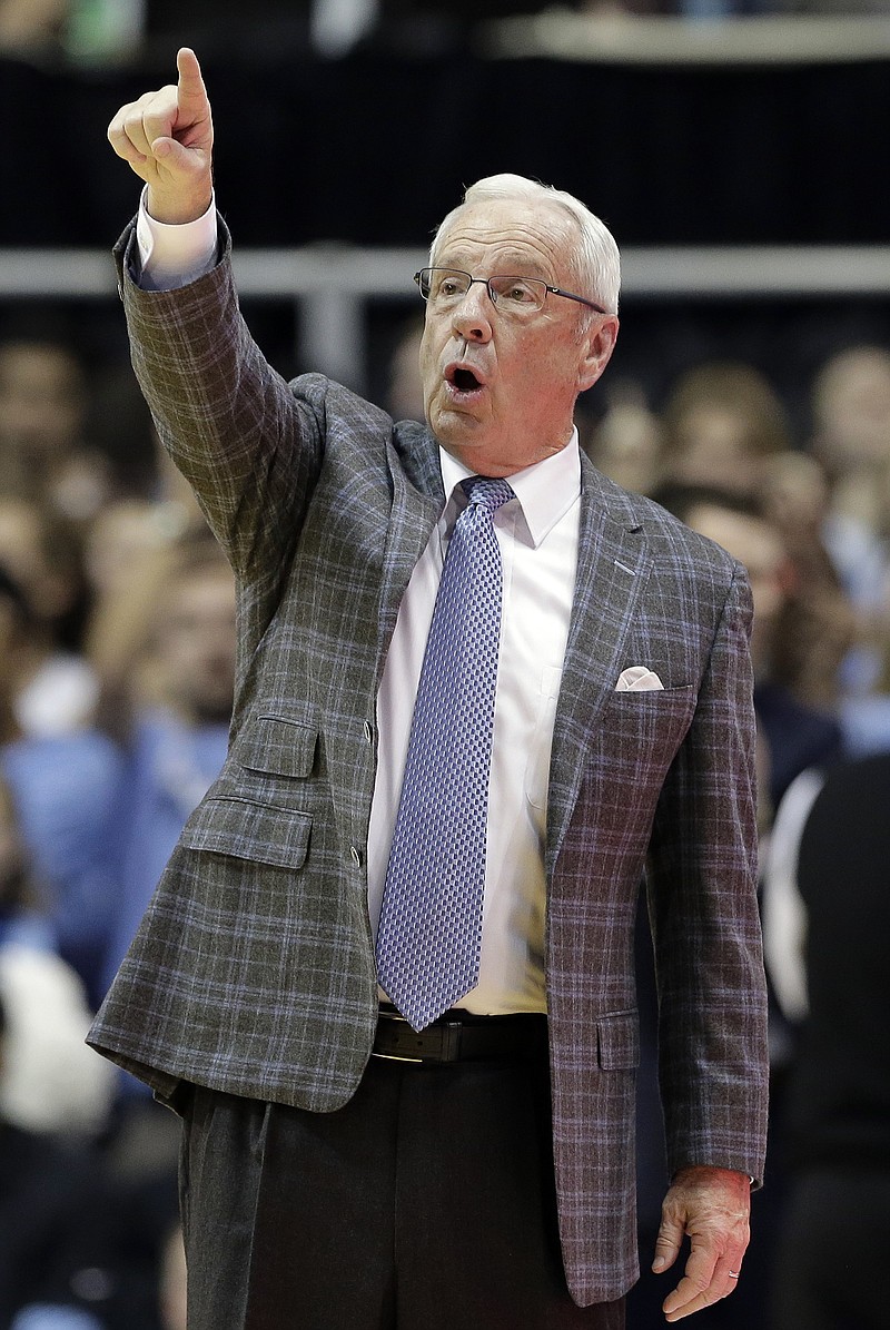 
              North Carolina head coach Roy Williams directs his team during the second half of an NCAA college basketball game against Virginia in Chapel Hill, N.C., Saturday, Feb. 18, 2017. North Carolina won 65-41. (AP Photo/Gerry Broome)
            