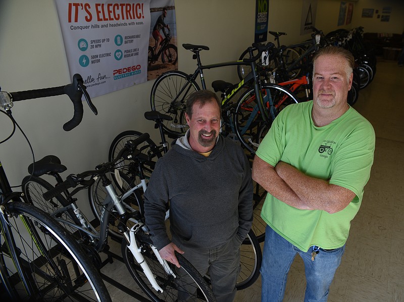 Cousins Patrick and David Bridges stand inside their new Battlefield Bikes shop located just down the street from the Chickamauga Battlefield.