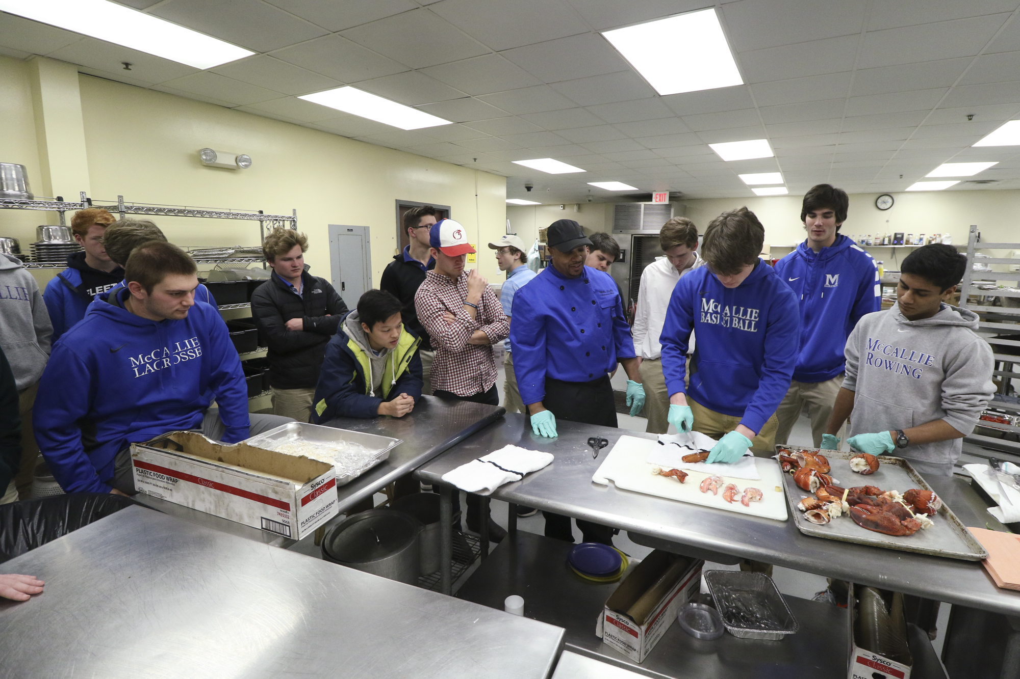 Much like the television version of "MasterChef," a demonstration was given, then the class had to replicate it. Chef Willie Dabbs leads students in removing lobster cleanly from the shell.