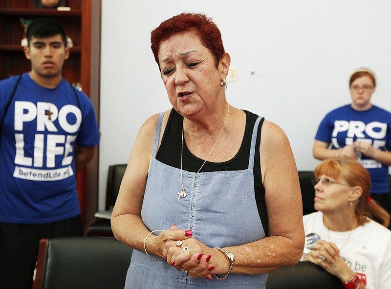 Norma McCorvey, center, was the plaintiff "Roe" in the Supreme Court case Roe v. Wade that led to the permitting of legal abortion, but she for nearly 20 years has said joining the case was a big mistake.