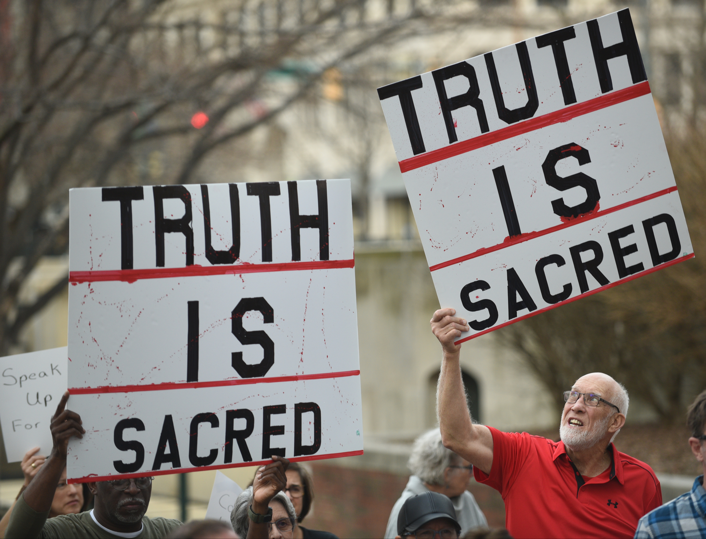 Cary Garrett, left, and Franklin McCallie hold signs during a Welcome Home for Recess Rally across from the Joel Solomon Federal Building Monday Feb. 20, 2017 in Miller Park. Recess Coalition for Chattanooga is calling for politicians to meet with their constituents.
