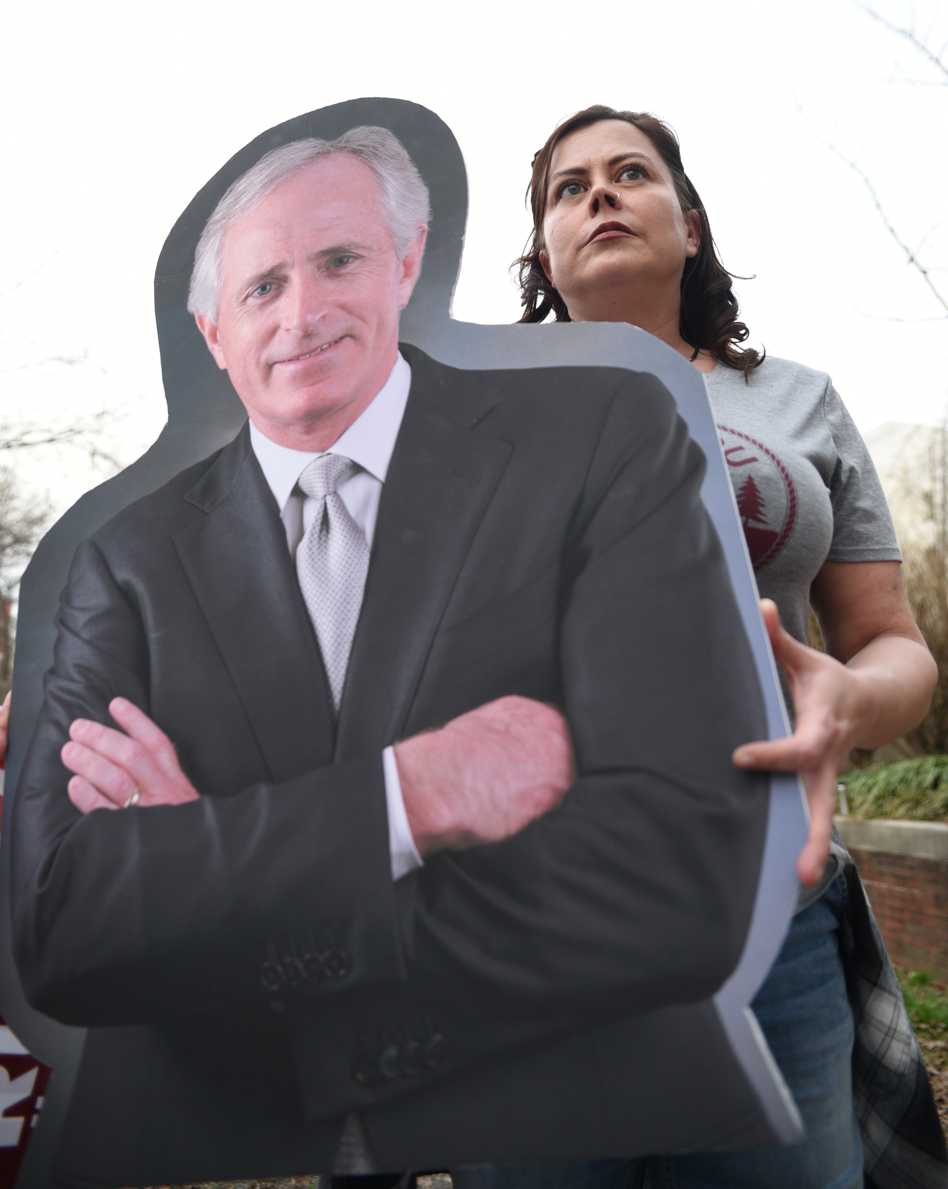 Karen Carr holds a cutout of Sen. Bob Corker during a rally Monday Feb. 20, 2017 in Miller Park.