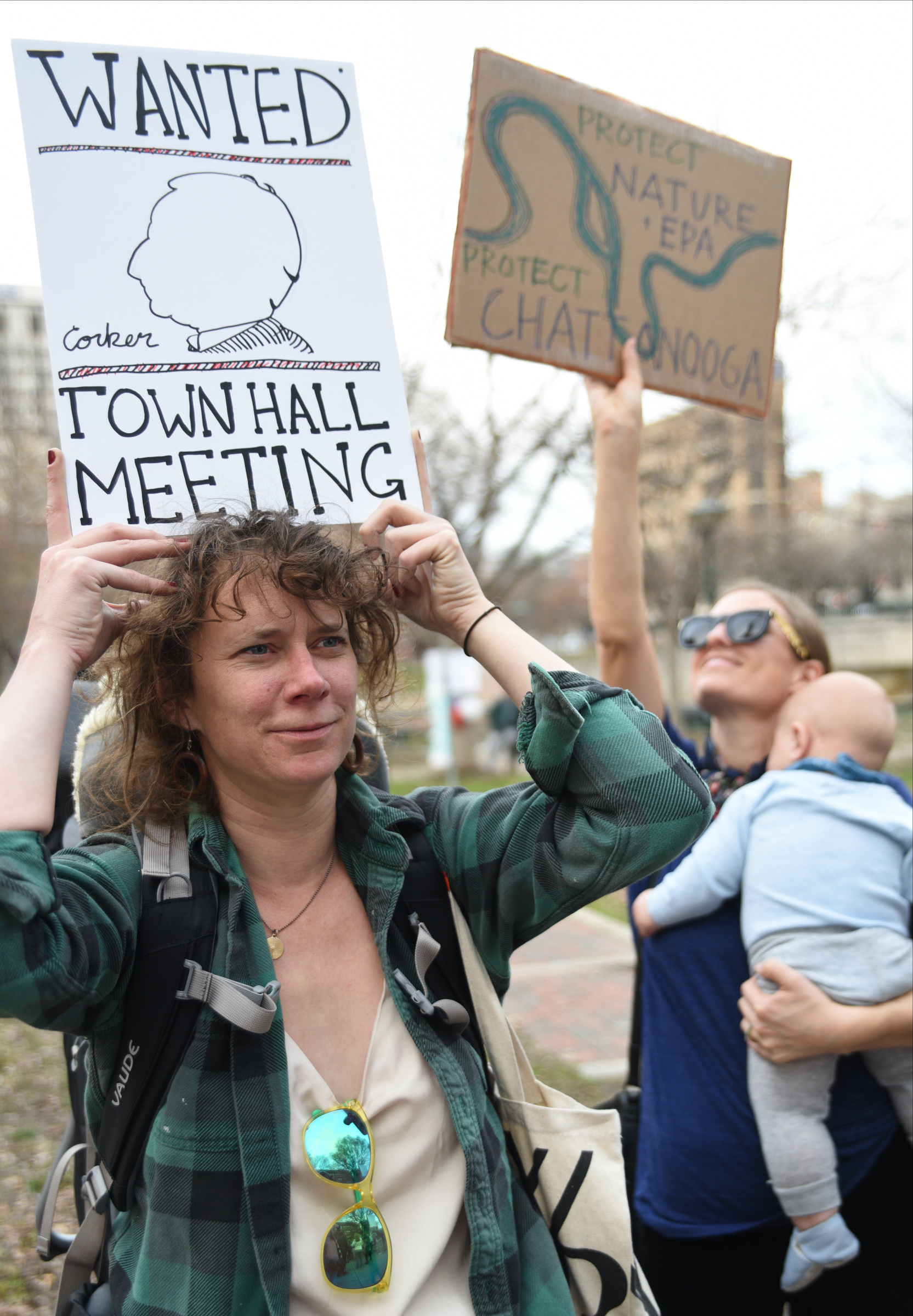 Charlotte Caldwell, left, and Kate Boehm, holding Coltrane Boehm, hold signs during a Welcome Home for Recess Rally across from the Joel Solomon Federal Building Monday Feb. 20, 2017 in Miller Park. Recess Coalition for Chattanooga is calling for politicians to meet with their constituents.